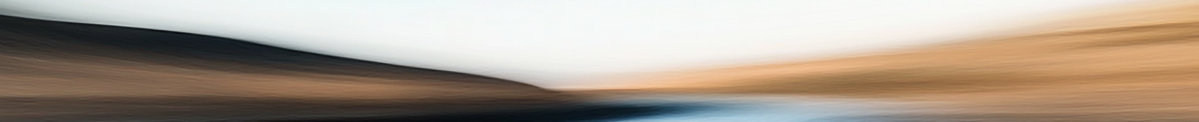 Man on bench reading newspaper