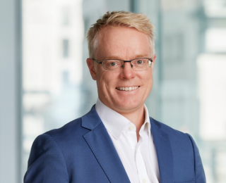 Man with glasses smiling